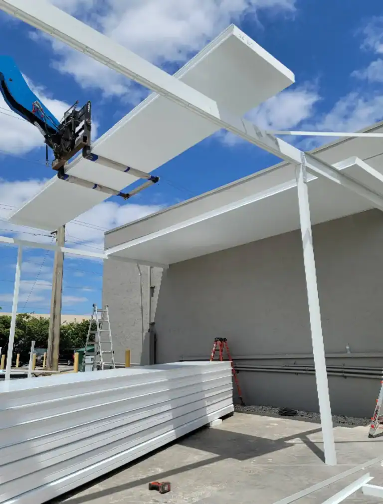 Aluminum patio cover installation in progress at commercial property