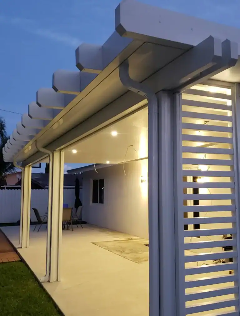 Custom white aluminum pergola with integrated lighting