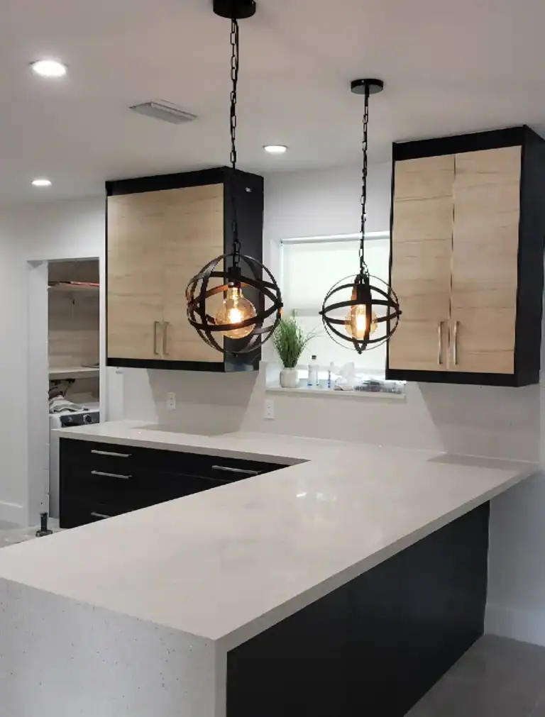 Custom modern kitchen renovation with pendant lighting and quartz countertops
