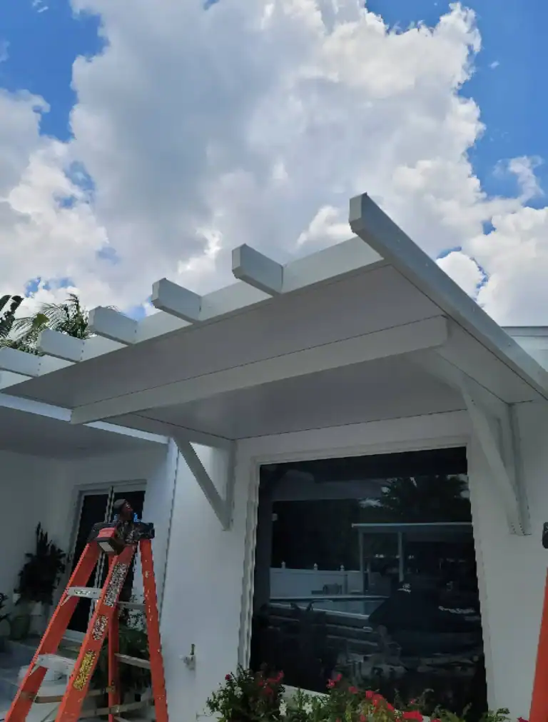 White aluminum pergola patio cover attached to residential home