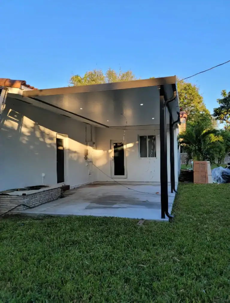 Modern aluminum patio cover installed in Florida backyard