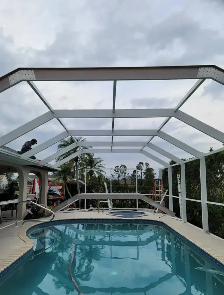 Pool screen enclosure under construction at residential property in Florida