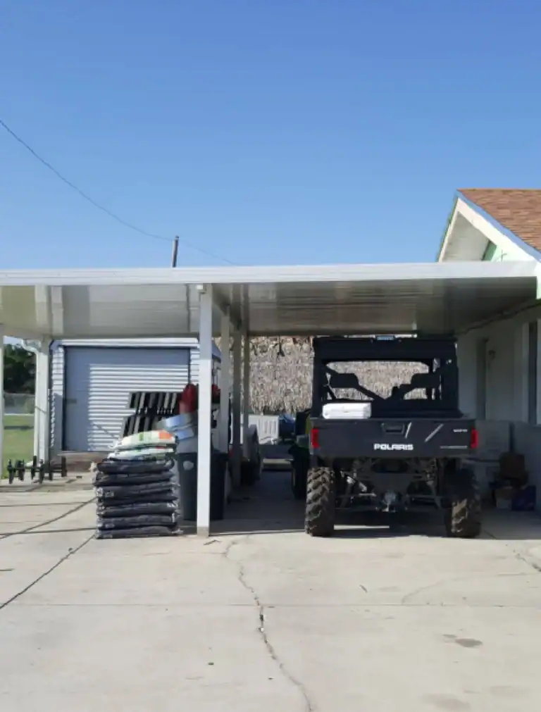 Residential aluminum patio cover used as carport and storage area