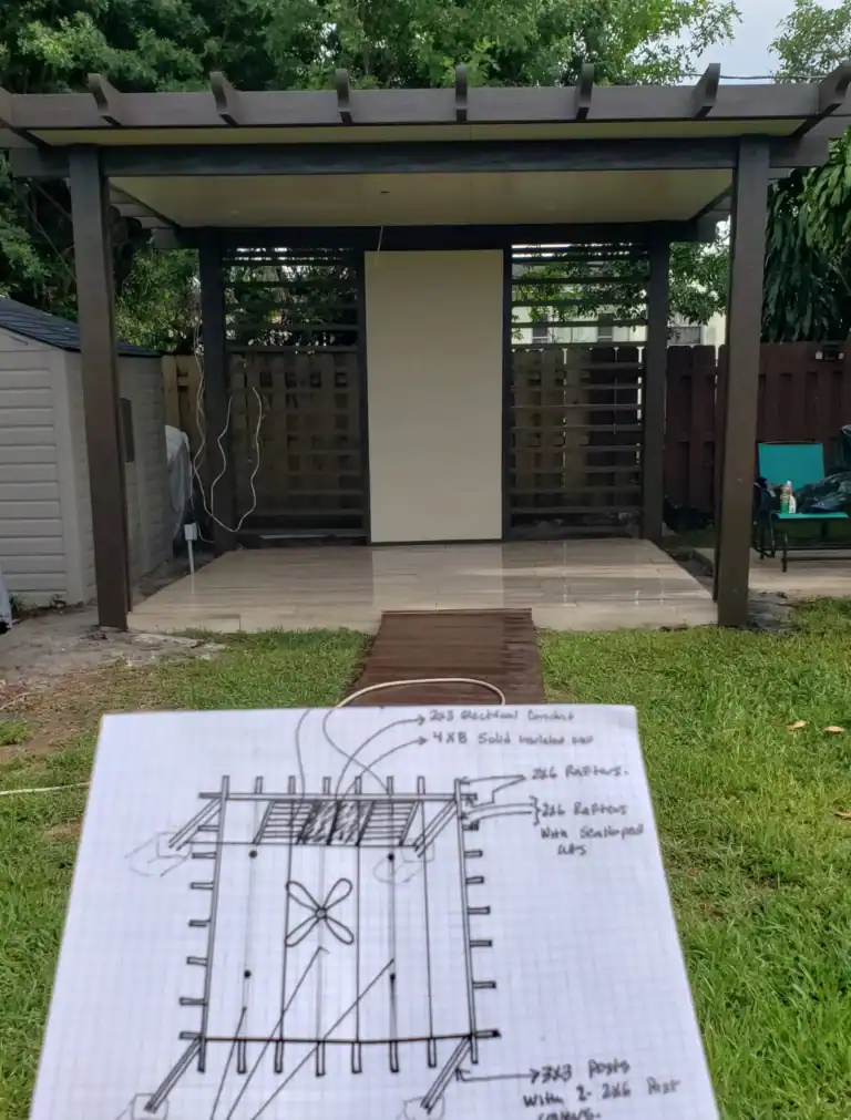 Brown aluminum pergola patio cover attached to residential home